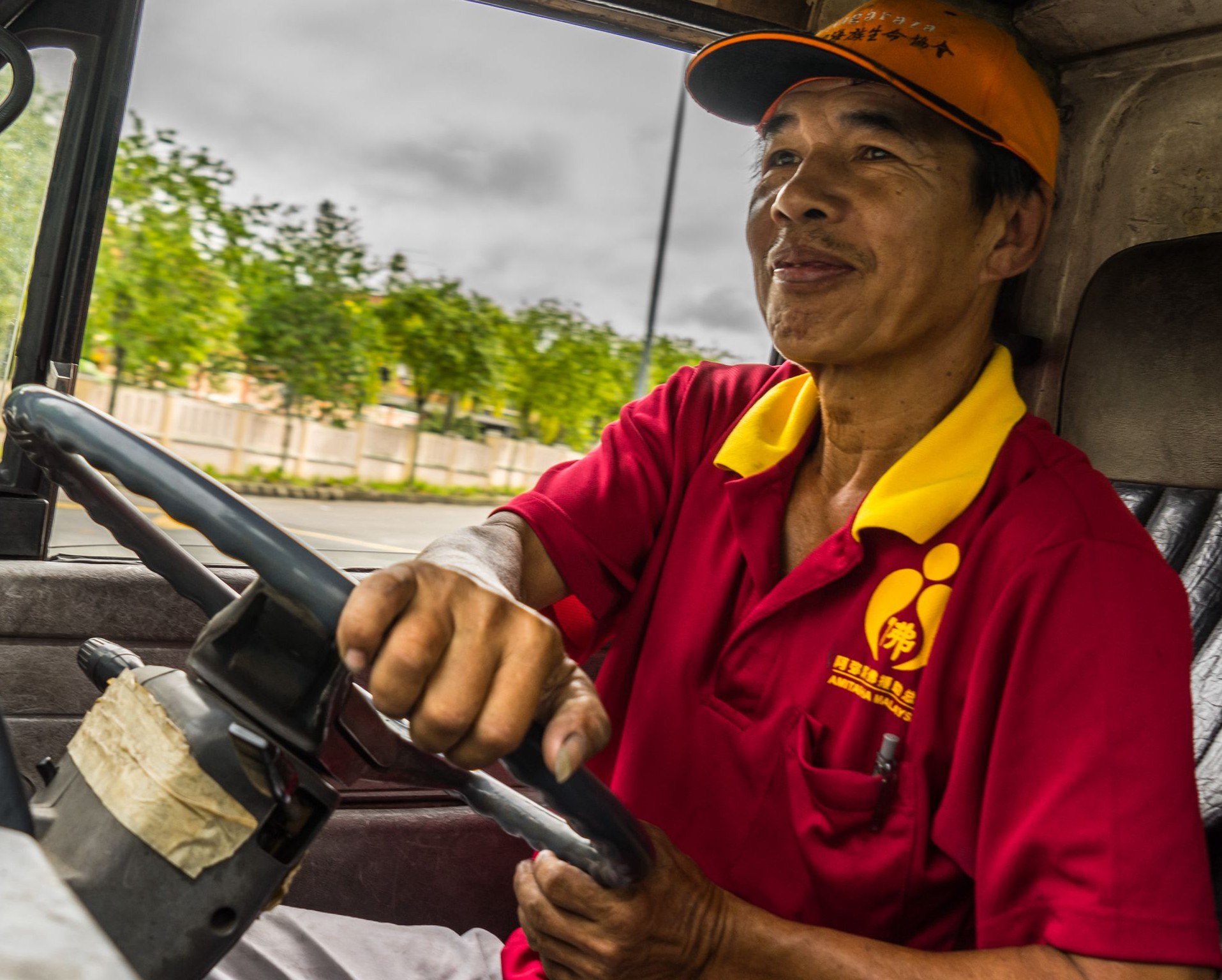 Yellow Bin driver collecting donated textiles for recycling in Johor Bahru